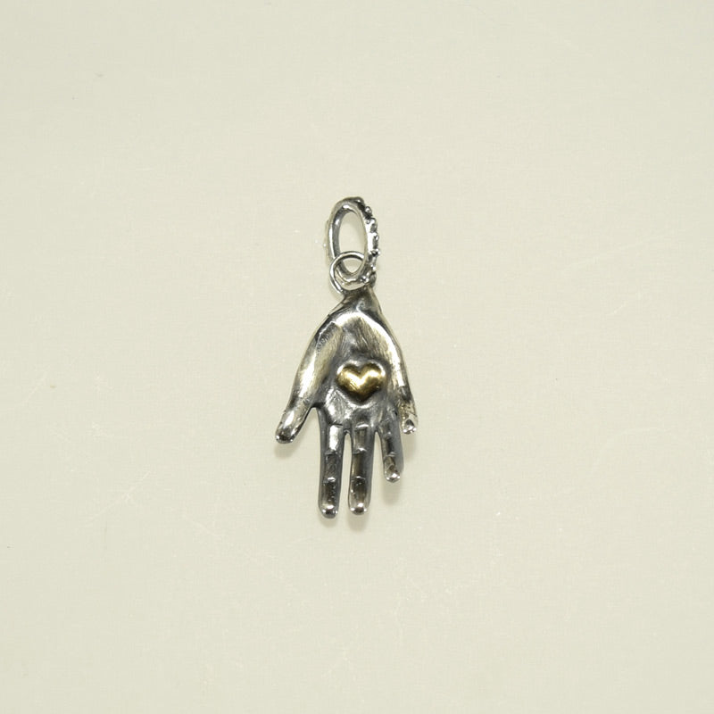 SILVER HEART IN HAND CHARM